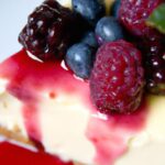 Creamy Greek Yogurt Cheesecake with Vibrant Berry Topping
