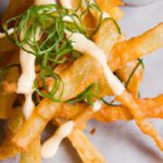 Crispy Yuca Fries Paired with Zesty Wasabi Aioli Delight
