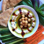 Elevate Your Snack Game with Green Harissa Hummus Plates